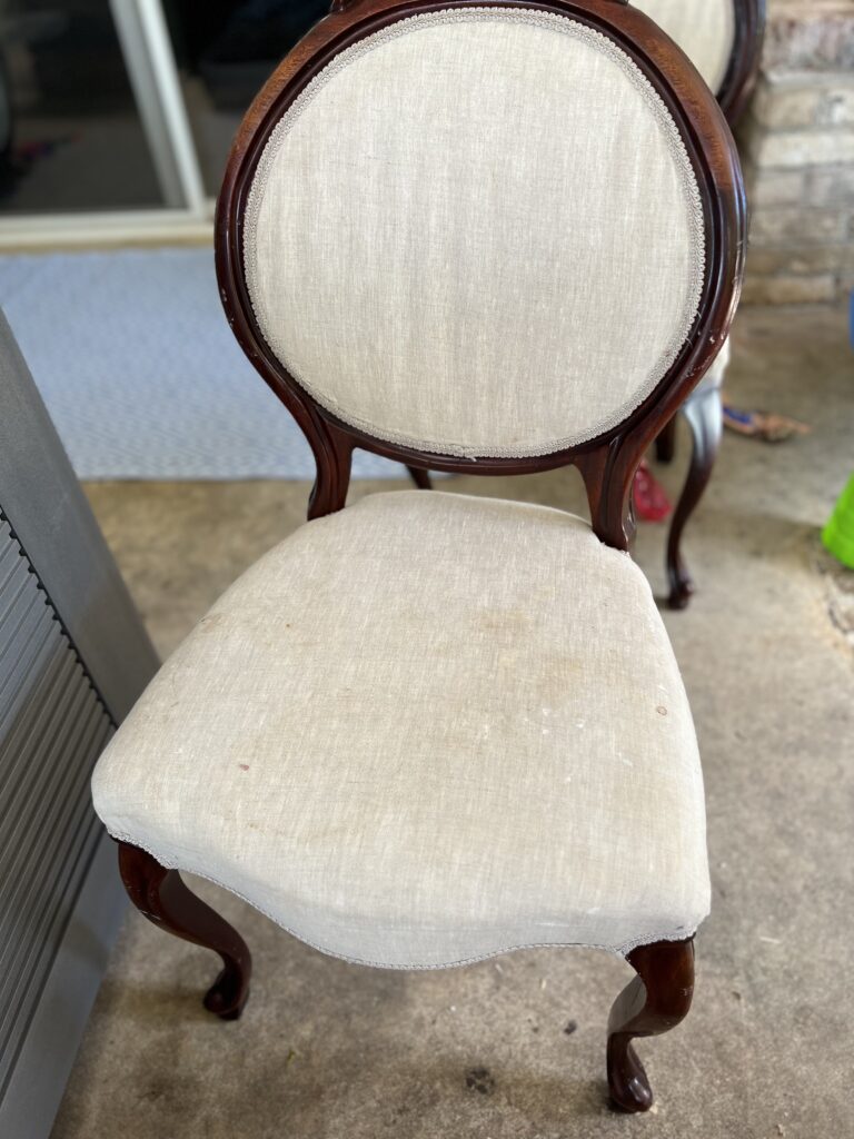 cream linen chairs in louis style with rose at the top