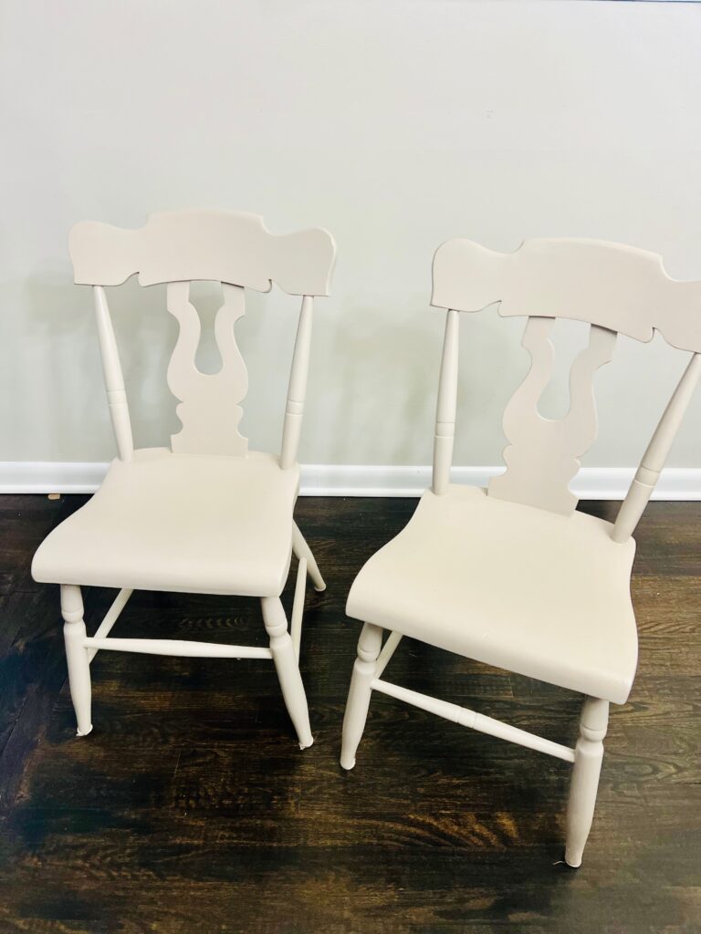 Dark floor with neutral wall and neutral spray painted chairs